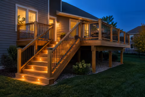 Broad steps and a warm evening glow extend the day outdoors.