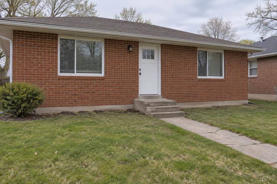 A new front-entry wood deck — starting view.